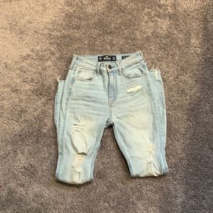 Light wash distressed super skinny crop jeans.